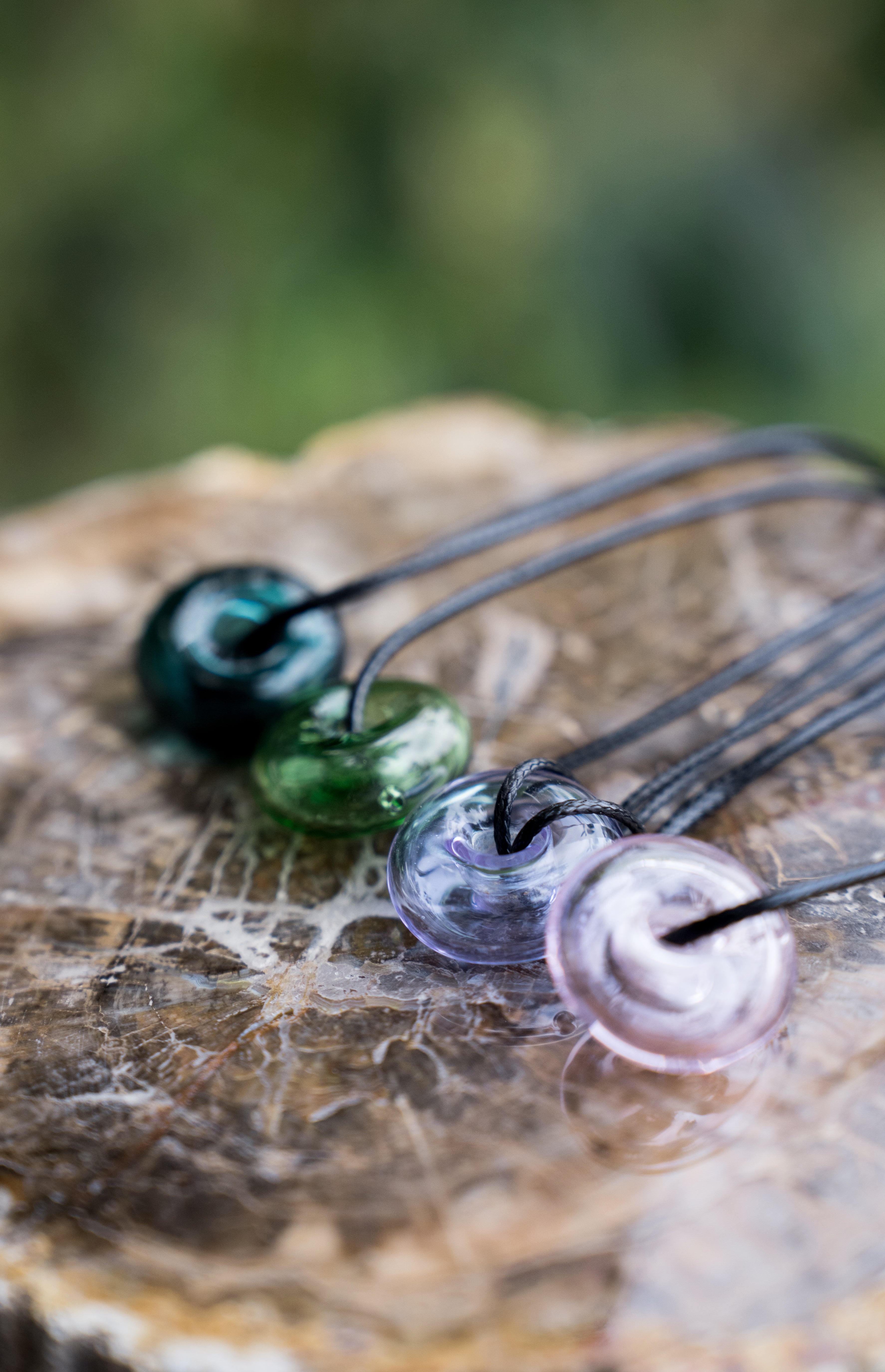 donut shape essential oil glass bottle necklace with black strap