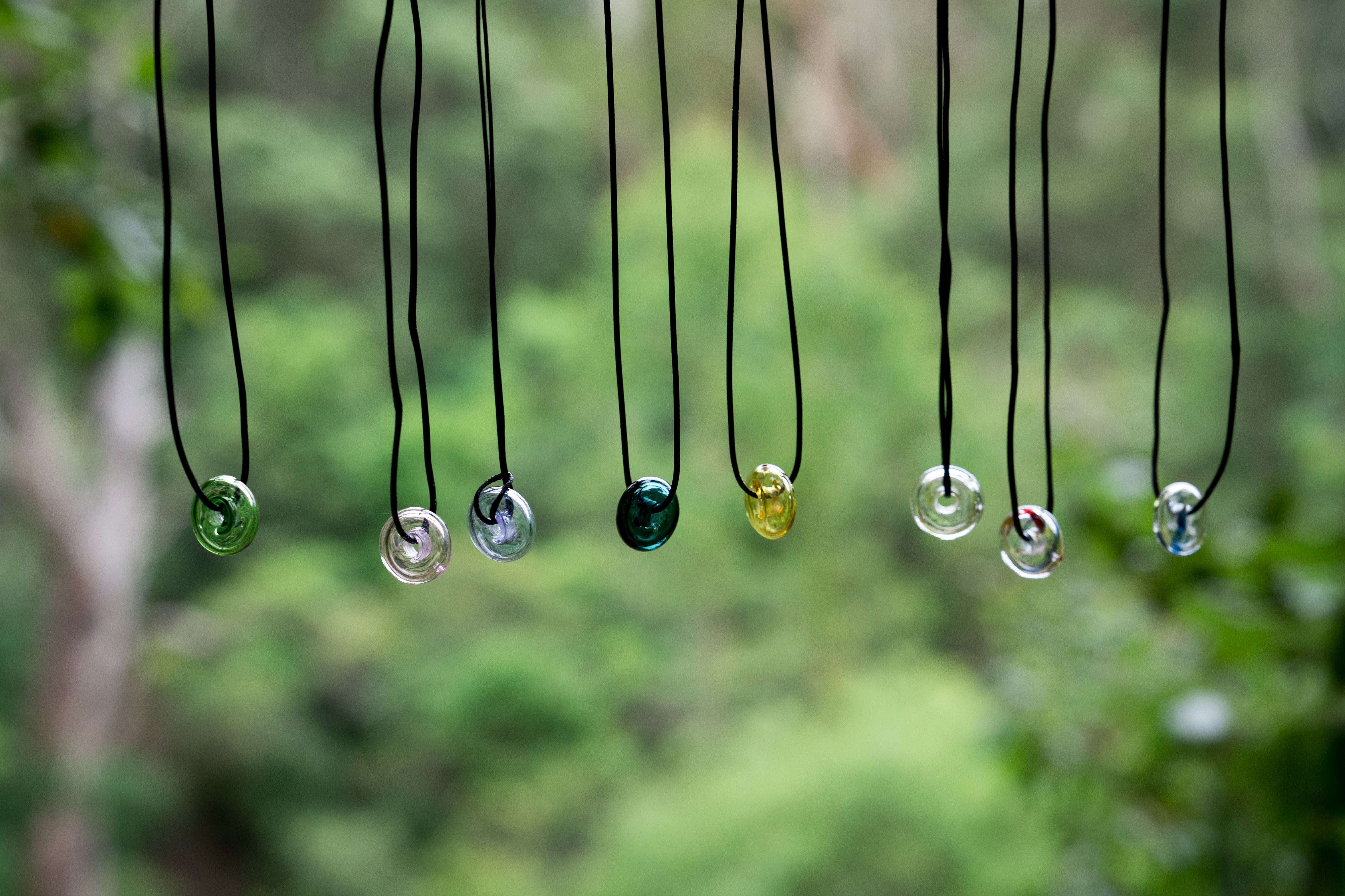 donut shape essential oil glass bottle necklace with black strap