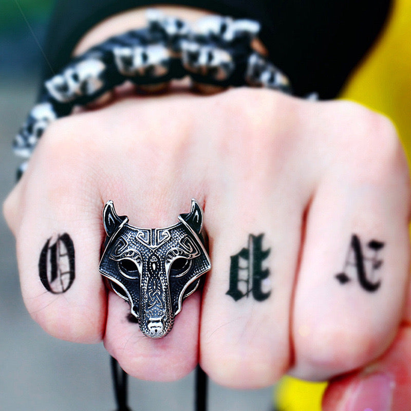 man wearing silver wolf mask ring