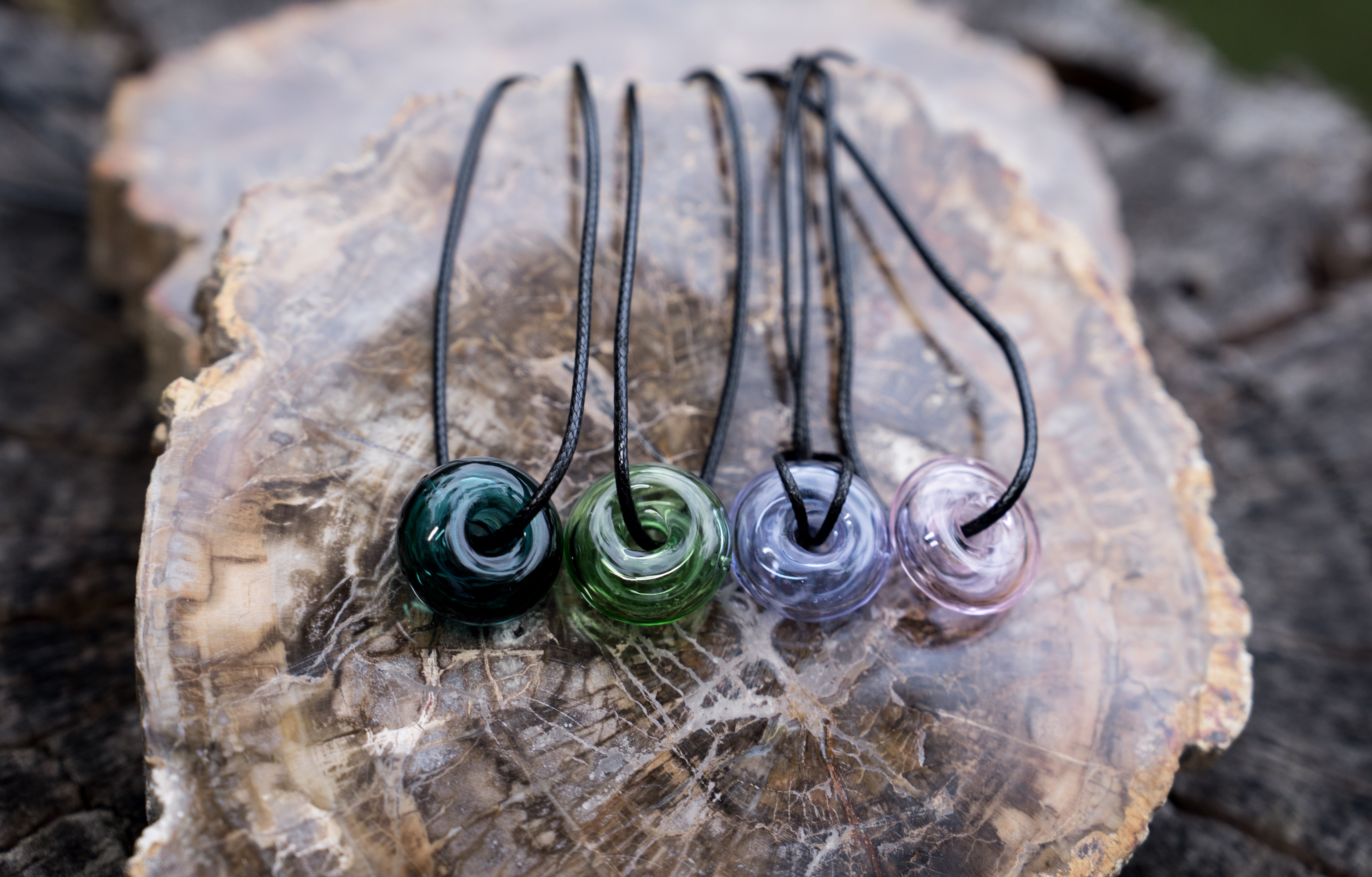 donut shape essential oil glass bottle necklace with black strap