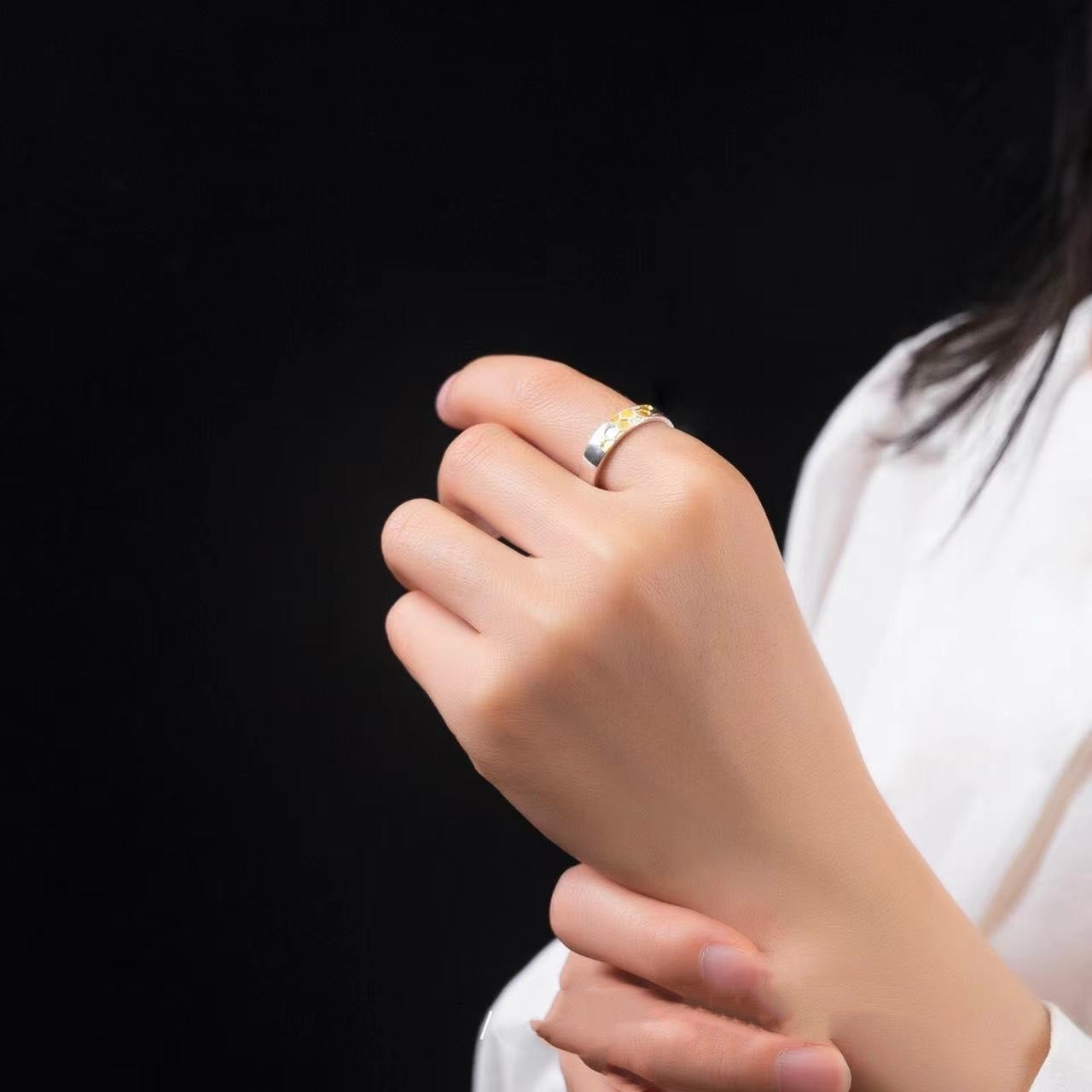 woman wearing silver bee hive ring with gold plated design