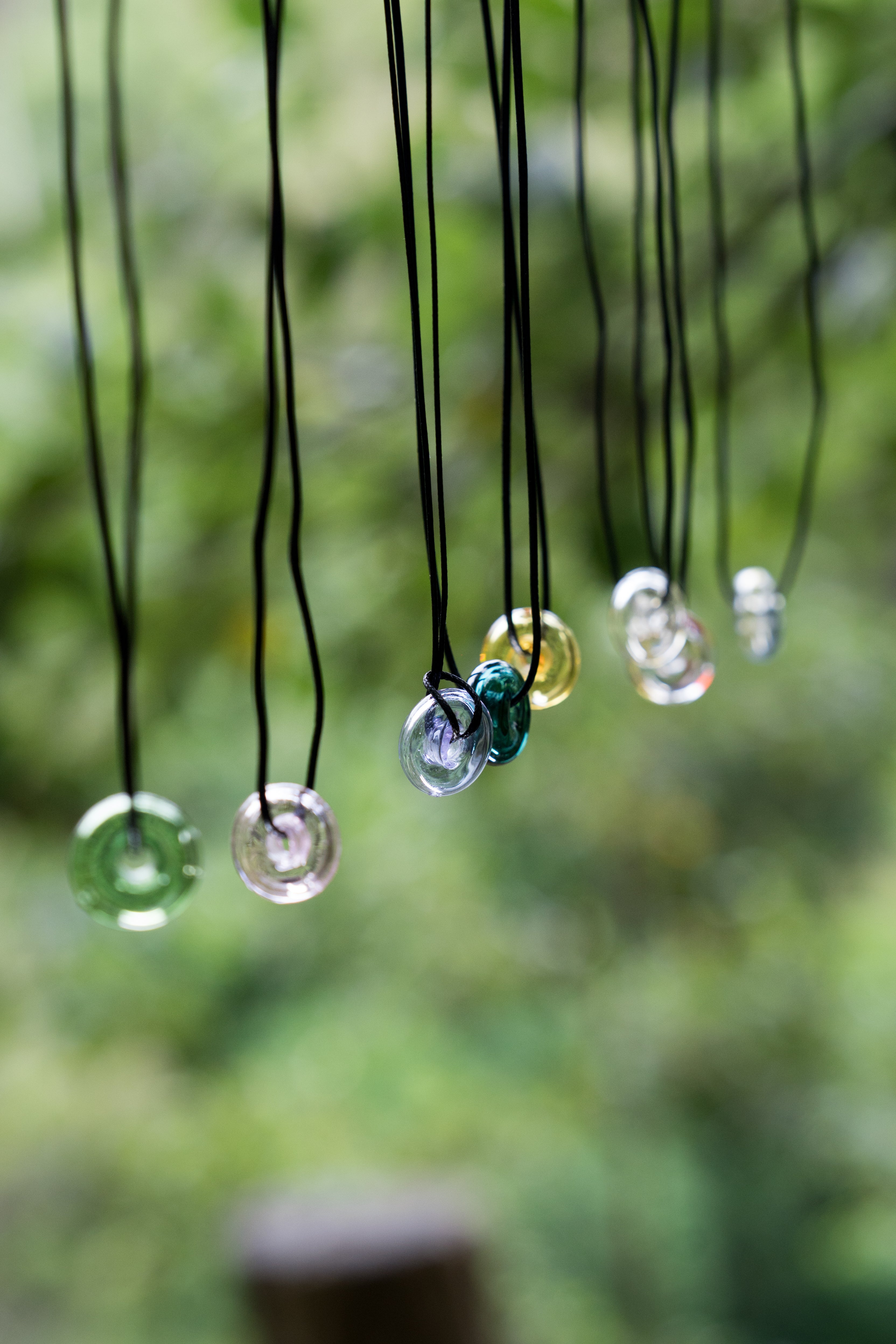 donut shape essential oil glass bottle necklace with black strap