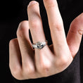 Load image into Gallery viewer, man wearing silver owl ring with blue zirconia details
