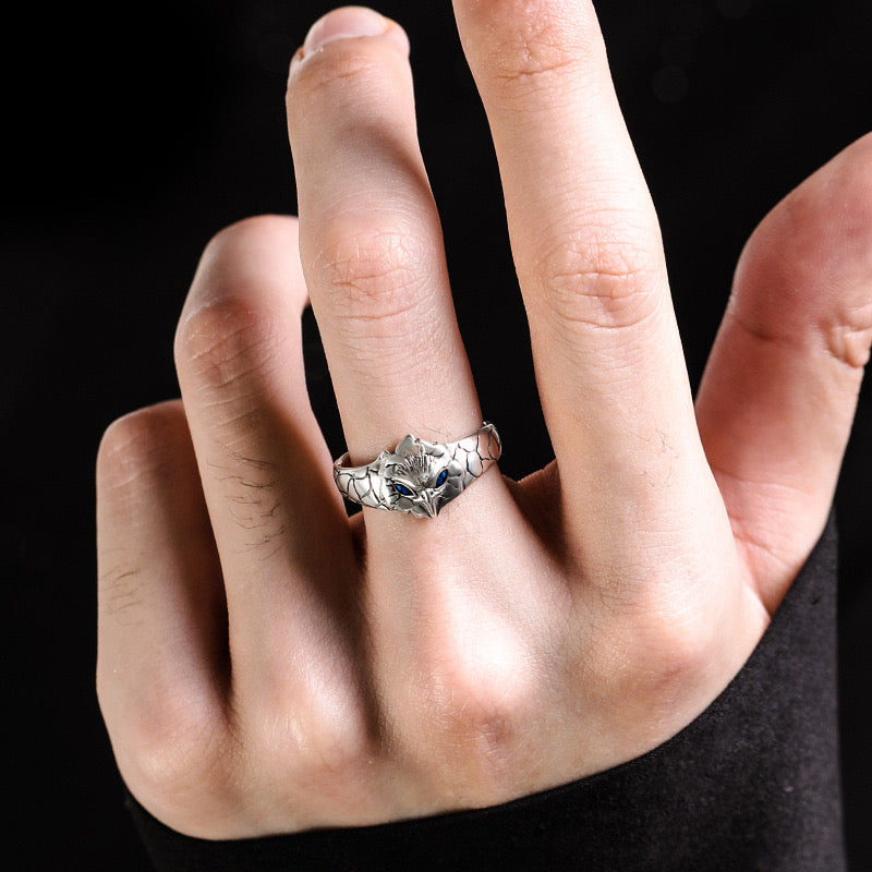 man wearing silver owl ring with blue zirconia details