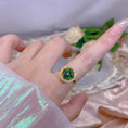 Load image into Gallery viewer, gold plated ring with green 4 leaf clover design
