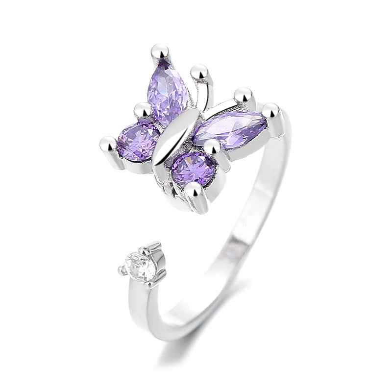 silver fidget ring with purple zirconia butterfly design