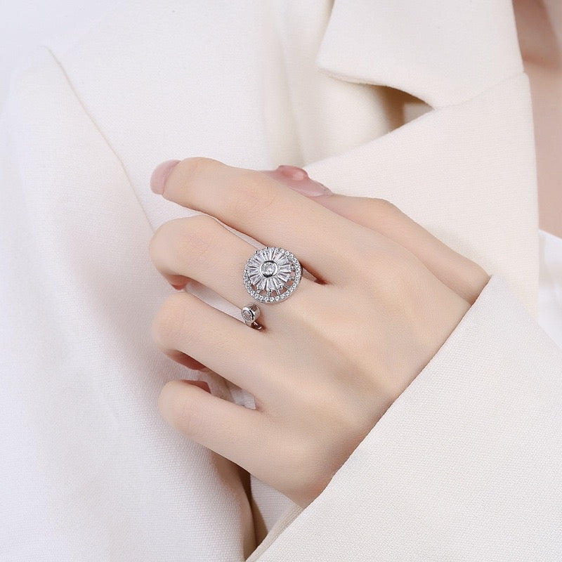 woman wearing silver fidget ring with blue zirconia butterfly design