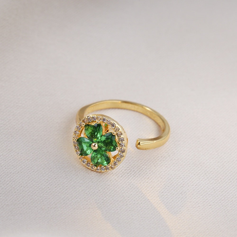 gold plated ring with green 4 leaf clover design