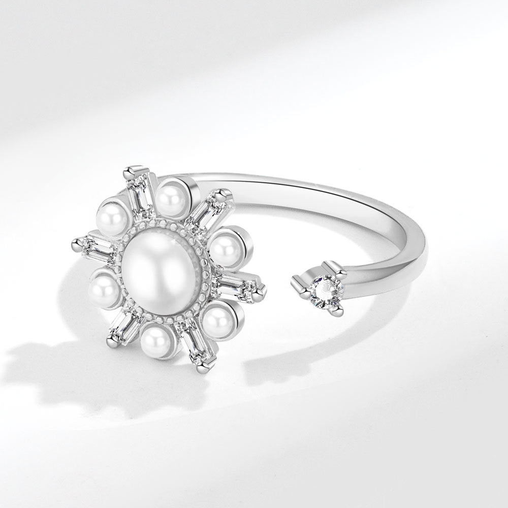 silver fidget ring with flower zirconia design