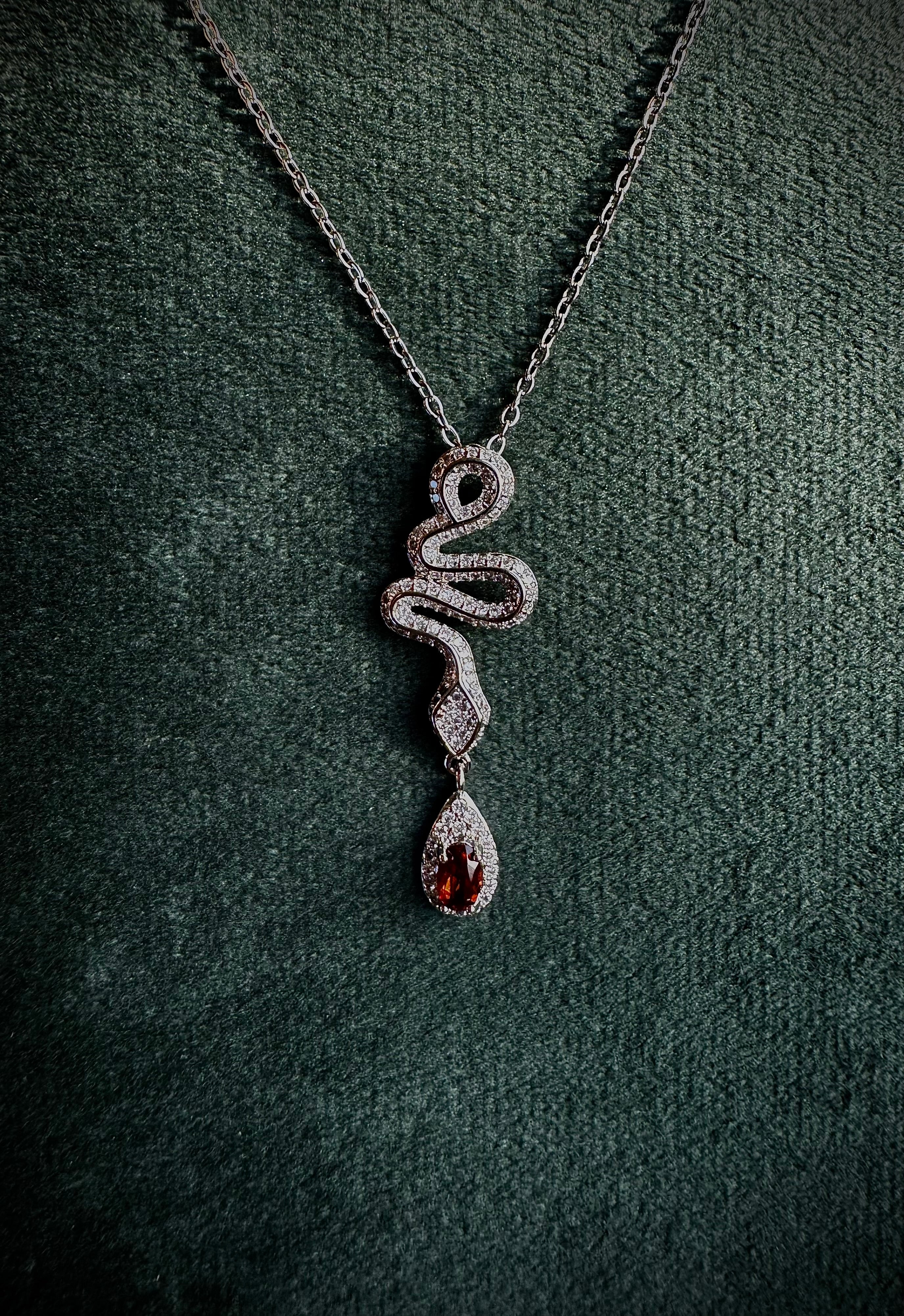 Silver Snake with Garnet Droplet