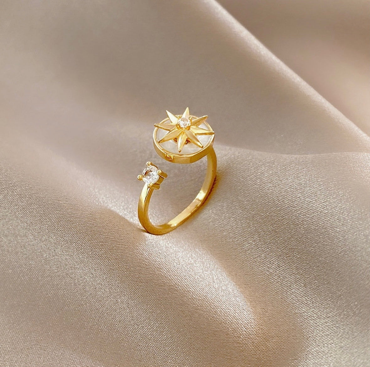 gold plated ring with pearl star design