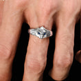 Load image into Gallery viewer, man wearing silver owl ring with blue zirconia details
