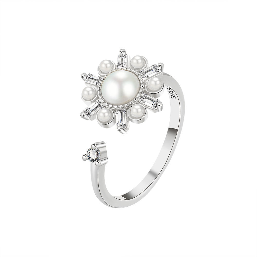 silver fidget ring with flower zirconia design