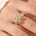 Load image into Gallery viewer, finger with gold fidget ring with zirconia windmill design
