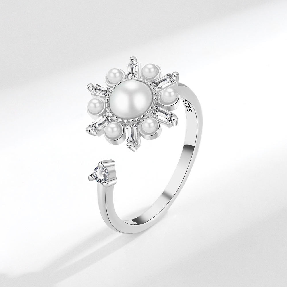 silver fidget ring with flower zirconia design