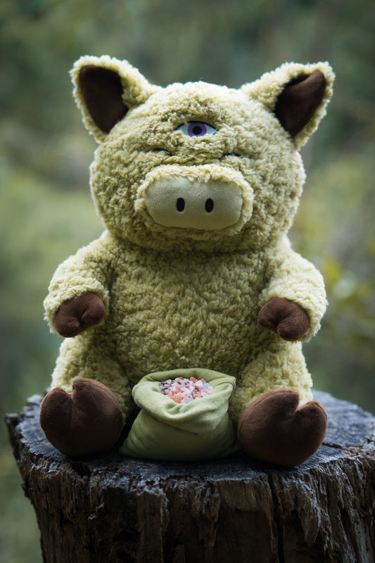 green pig plushie with pink himalayan salt