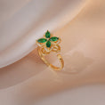 Load image into Gallery viewer, gold fidget ring with green clover pointed design
