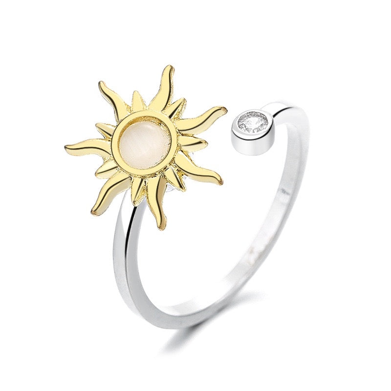 silver fidget ring with gold plated sun design