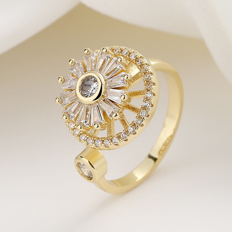 gold plated fidget ring with zirconia windmill design