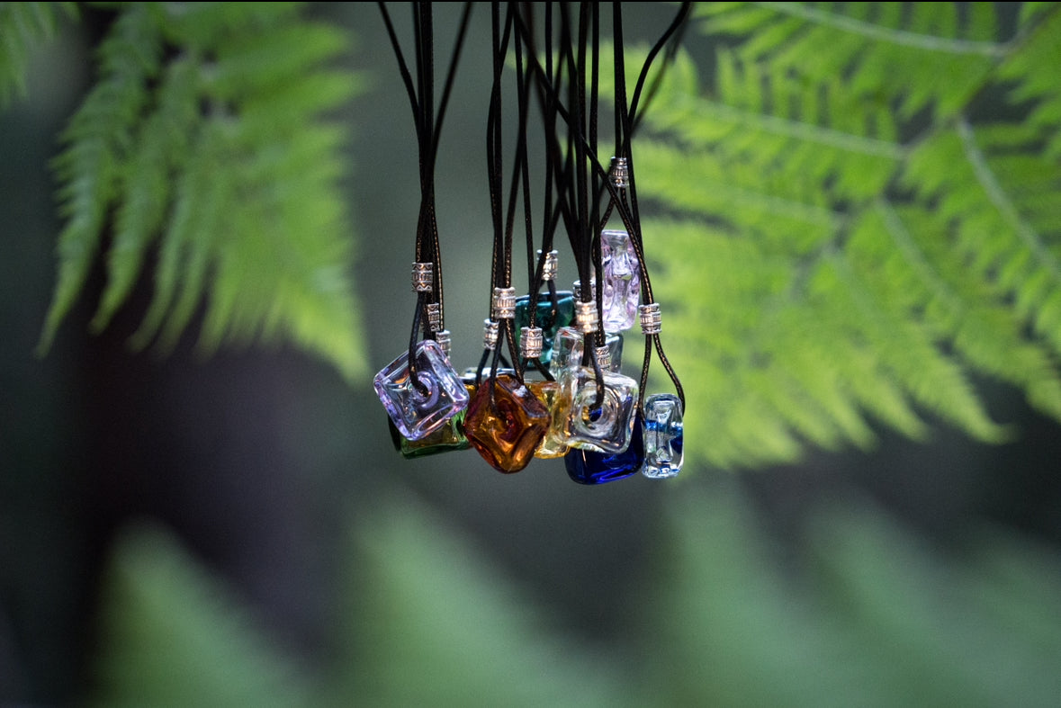 square oil bottle pendant with black string necklace