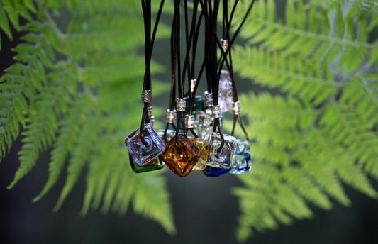 square oil bottle pendant with black string necklace