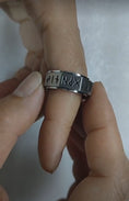 Load image into Gallery viewer, Ancient Viking Nordic Rune Fidget Ring holding by a hand
